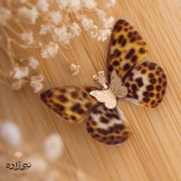 پلاک پروانه پارچه ای پلنگی طلا C048